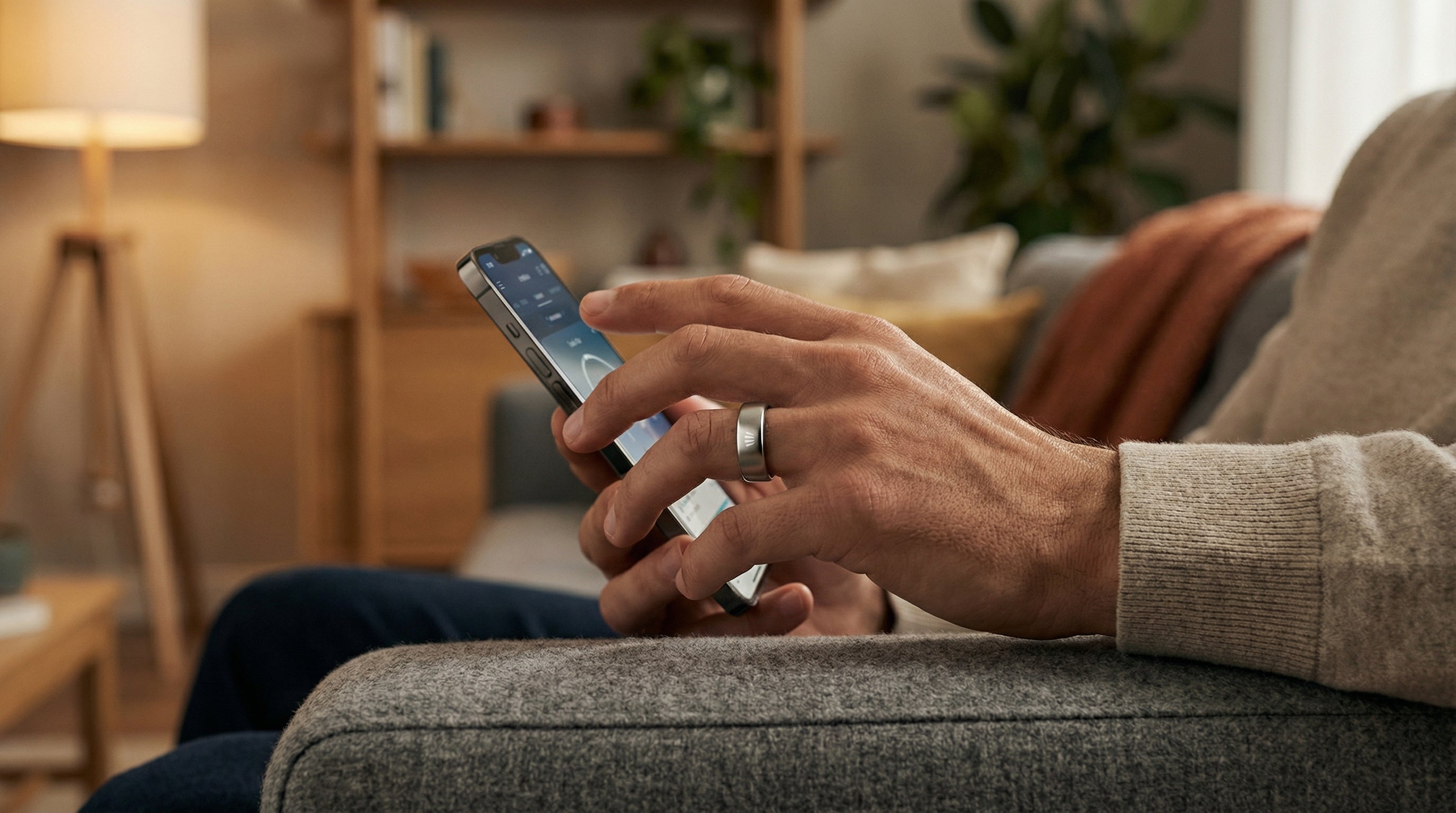 Smart ring syncing seamlessly with a mobile app to display real-time activity and recovery data.